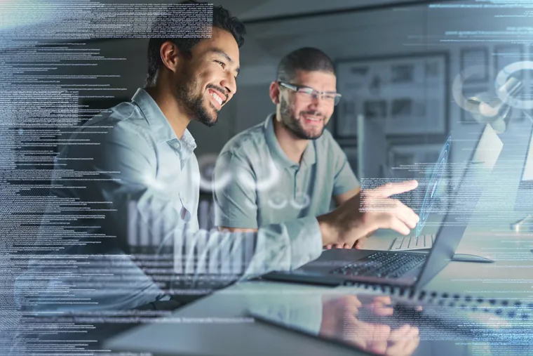 IT security specialists reviewing cybersecurity data together
