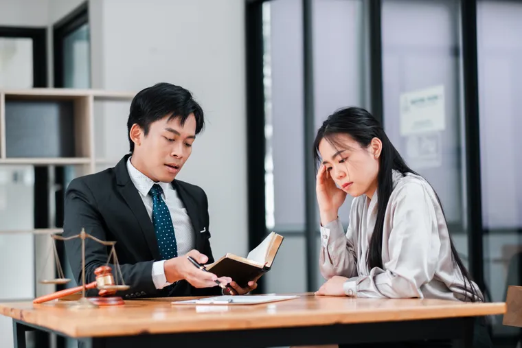 Attorneys discussing legal documents with a client