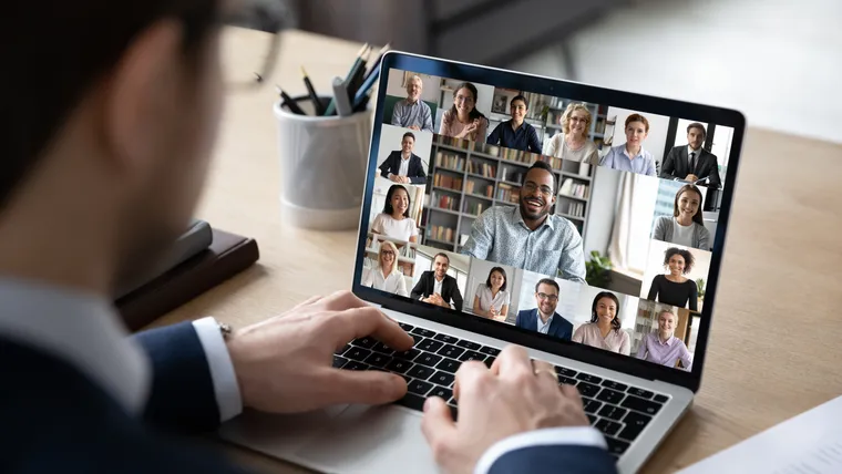 Remote team meeting by video conference on a laptop