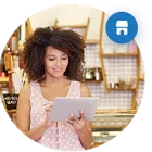 A small business owner working at the counter of their shop