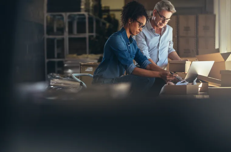 Small business partners managing online orders together